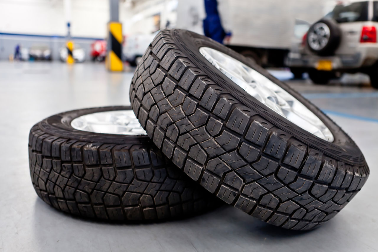 Car tires or wheels at an auto repair shop